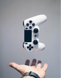 Hand holding a game controller